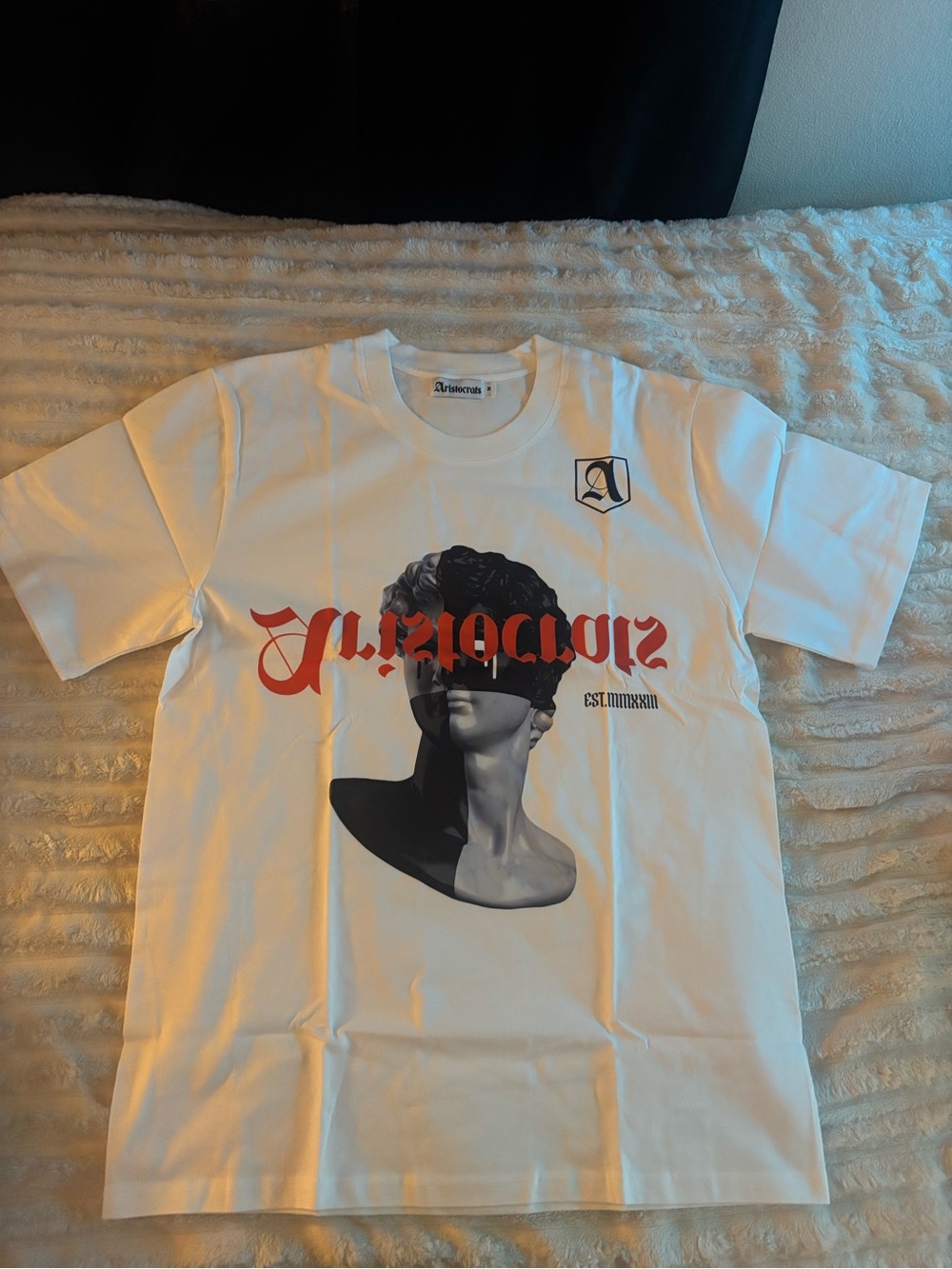 White Short Sleeve Graphic Tee with Red Script and Statue Motif